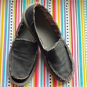 black Sanuk slip-ons